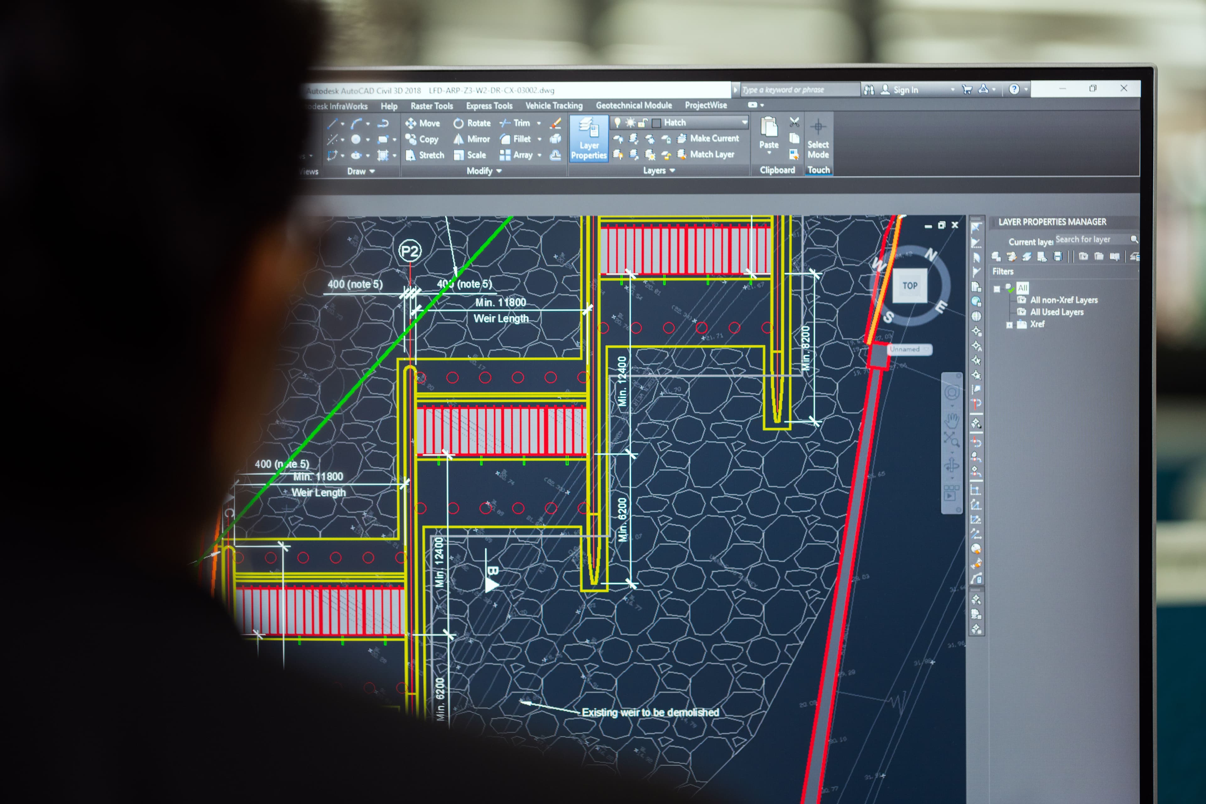 Engineer reviewing a construction drawing in AutoCAD Civil 3D on a computer screen